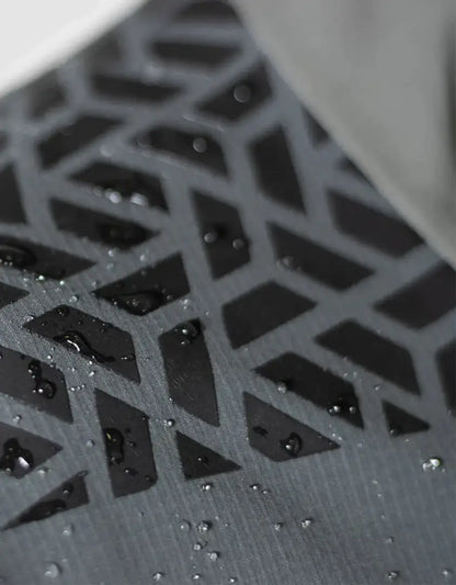 Textured water-spotted surface on Bushbuck Alpine Waterproof Jacket for outdoor adventures