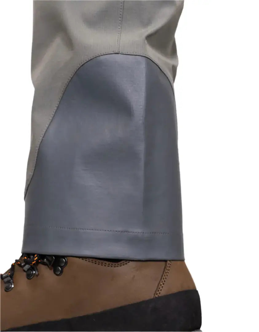 Gray waterproof pants over hiking boot, perfect for hunting and country clothing