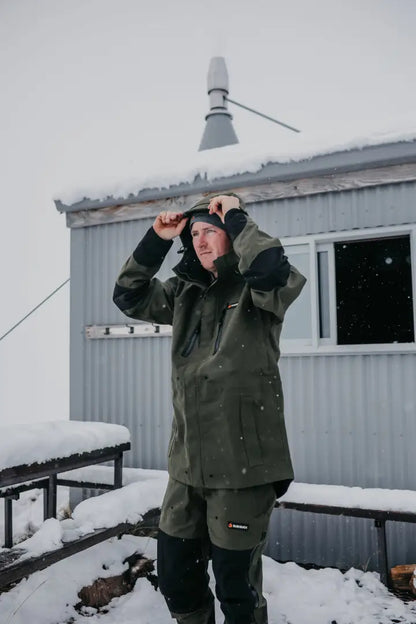 Man in olive green Bushbuck Defender Waterproof Trousers for hunting and country clothing