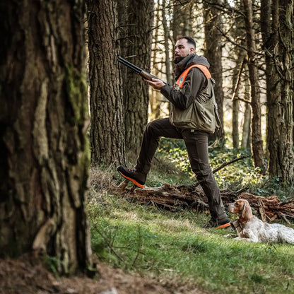Hunter in Crispi Track GTX Boots with dog enjoying the outdoors in a forest setting