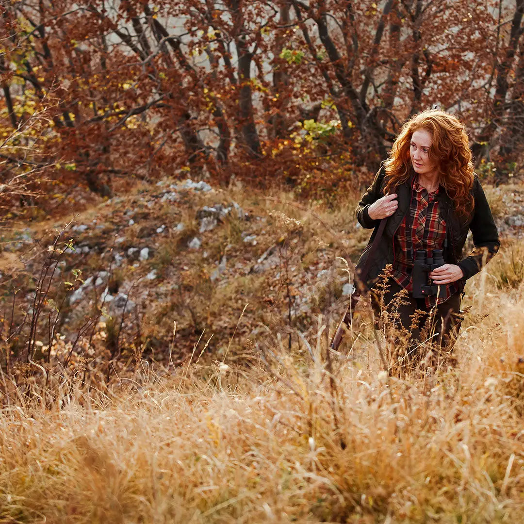 Red-haired woman hiking in a Deerhunter Lady Caroline Padded Jacket