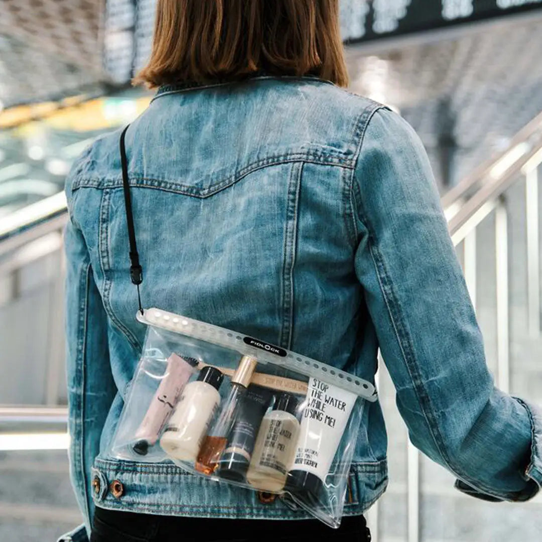 Clear Fidlock Multi Dry Bag filled with toiletries for easy travel and organization