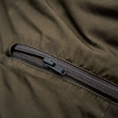 Olive green fabric Harkila Fjell Trousers with black zipper, perfect for country clothing