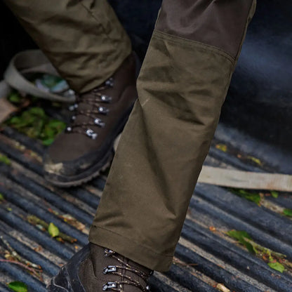 Brown hiking boots paired with Olive Green Harkila Fjell Trousers for country clothing adventures
