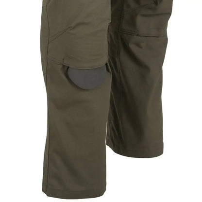 Olive green Helikon-Tex Woodsman Pants with side pocket for outdoor enthusiasts