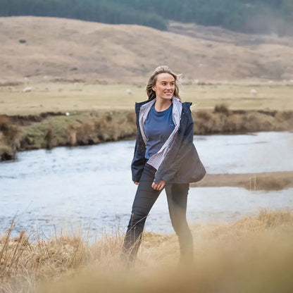 Woman wearing a Fife Fara Waterproof Jacket for outdoor adventures