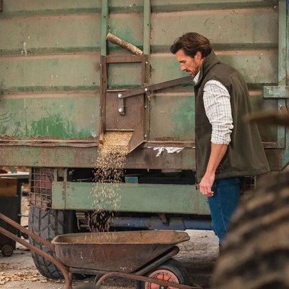 Grain-filled wheelbarrow showcasing Hoggs of Fife Green King II Gilet design