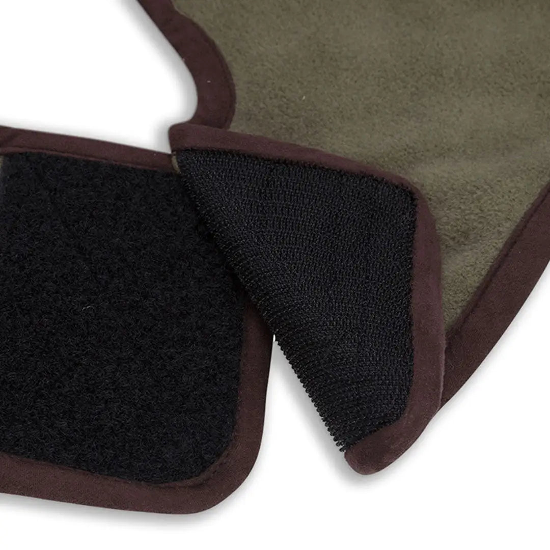 Olive green dog coat with brown trim and black velcro closures for country adventures
