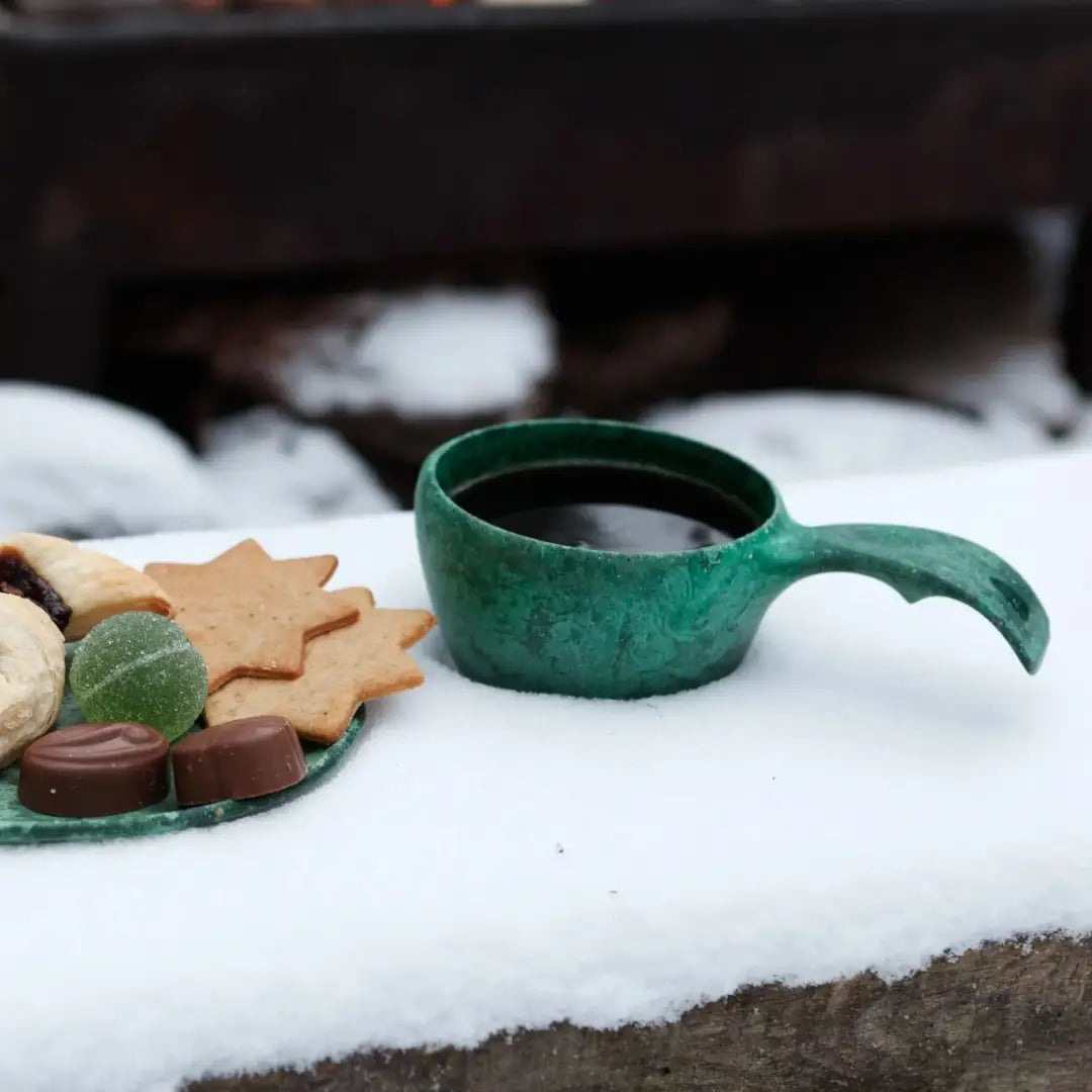 Green Kupilka Classic Cup with handle, perfect for outdoor adventures with natural fibre