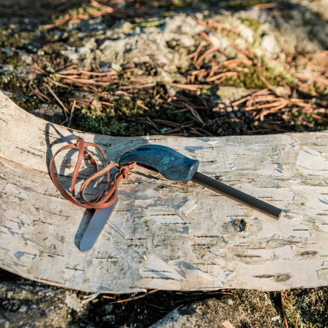 Blue-handled ferro rod with leather lanyard for Kupilka Firesteel to create sparks