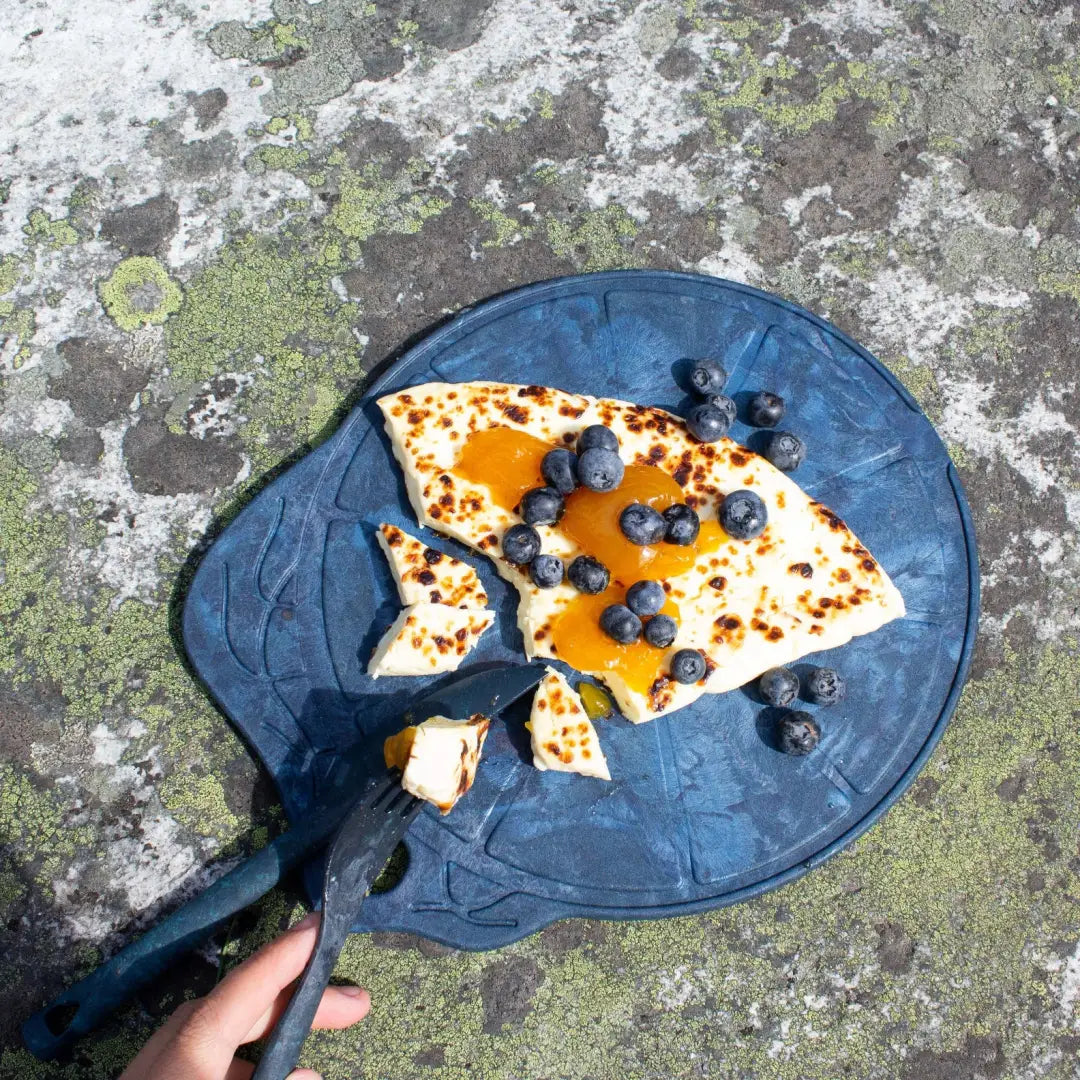 Blue leaf-shaped Kupilka Kaarna Medium Service Tray with pancakes, jam, and blueberries