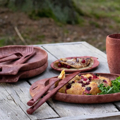 Rustic outdoor dining set with Kupilka Plate, perfect for country clothing and hunting vibes
