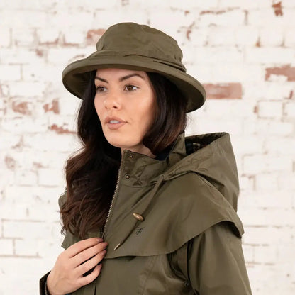 Olive green wide-brimmed hat on woman, perfect for the Lighthouse Canterbury Waterproof Ladies style