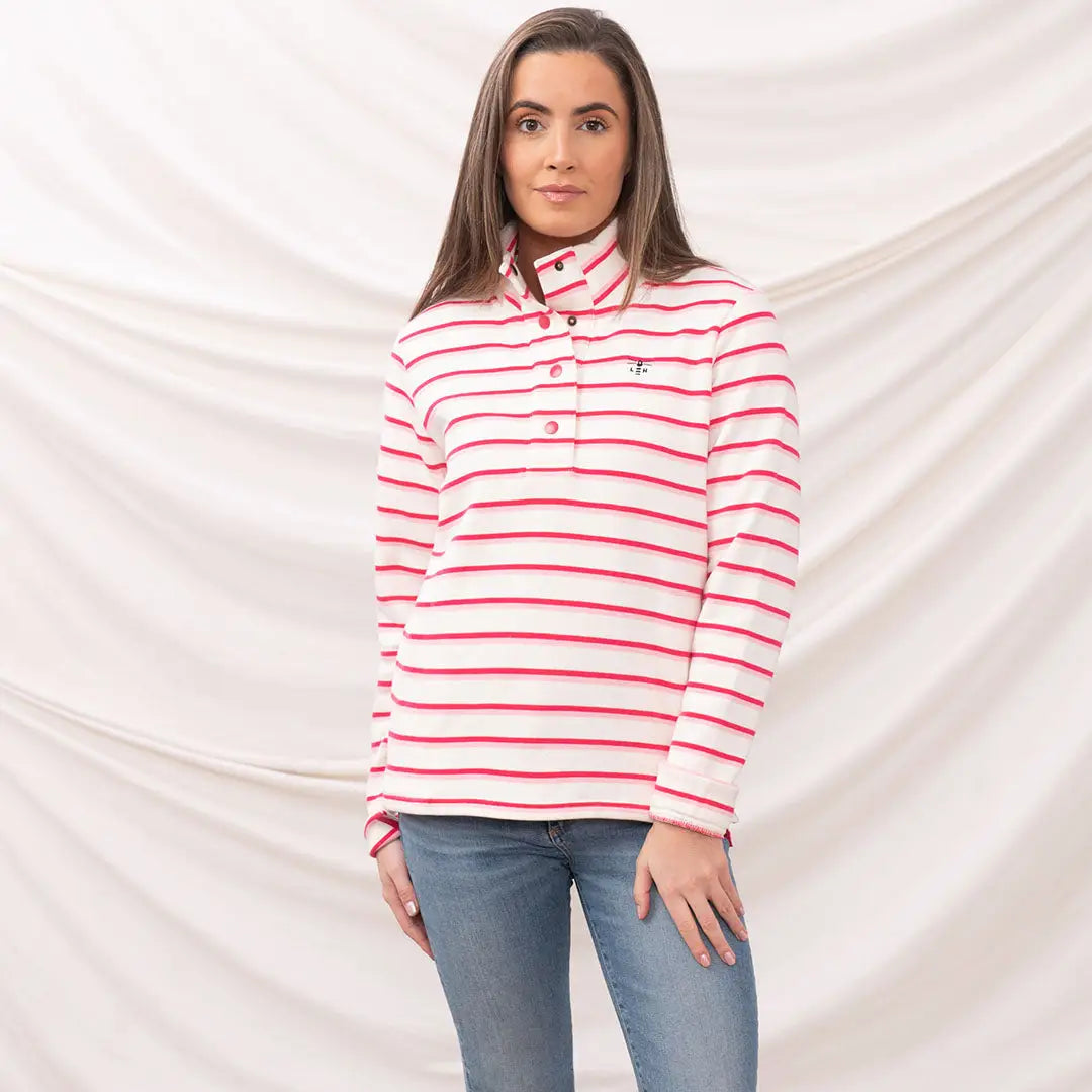 Woman in striped button-up shirt and jeans wearing Lighthouse Ladies Haven II Jersey