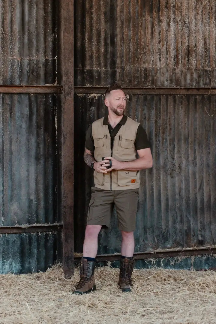 Man in outdoor attire wearing New Forest 10 Inch Hunters boots for country pursuits conquer