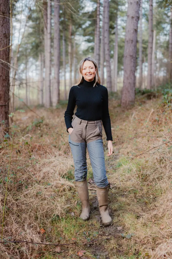 Woman wearing Forest Nightjar Trousers in a stylish outdoor setting