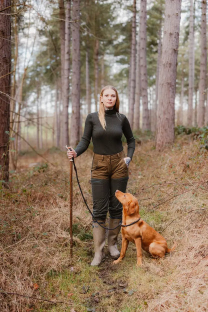 Woman in forest with dog wearing stylish Forest Nightjar Trousers