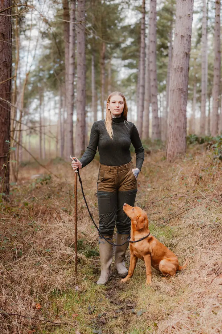 Woman in forest with dog wearing stylish Forest Nightjar Trousers