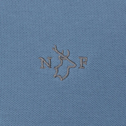 Blue fabric of the New Forest Pique Polo Shirt with embroidered logo detail