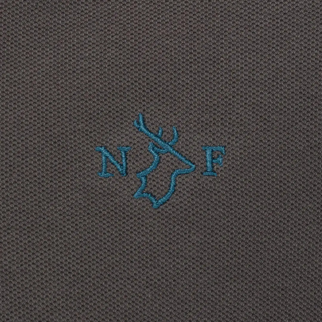 Close-up of embroidered detail on New Forest Pique Polo Shirt showcasing quality pique polo