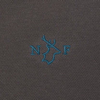 Close-up of embroidered detail on New Forest Pique Polo Shirt showcasing quality pique polo