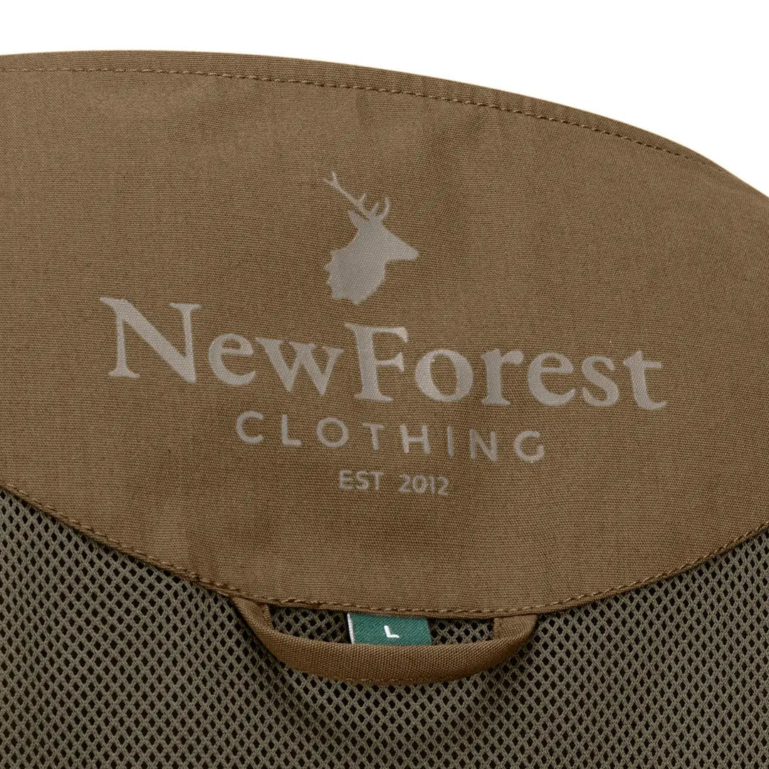 Clothing label featuring a deer logo on the New Forest V-Neck Explorer Gilet