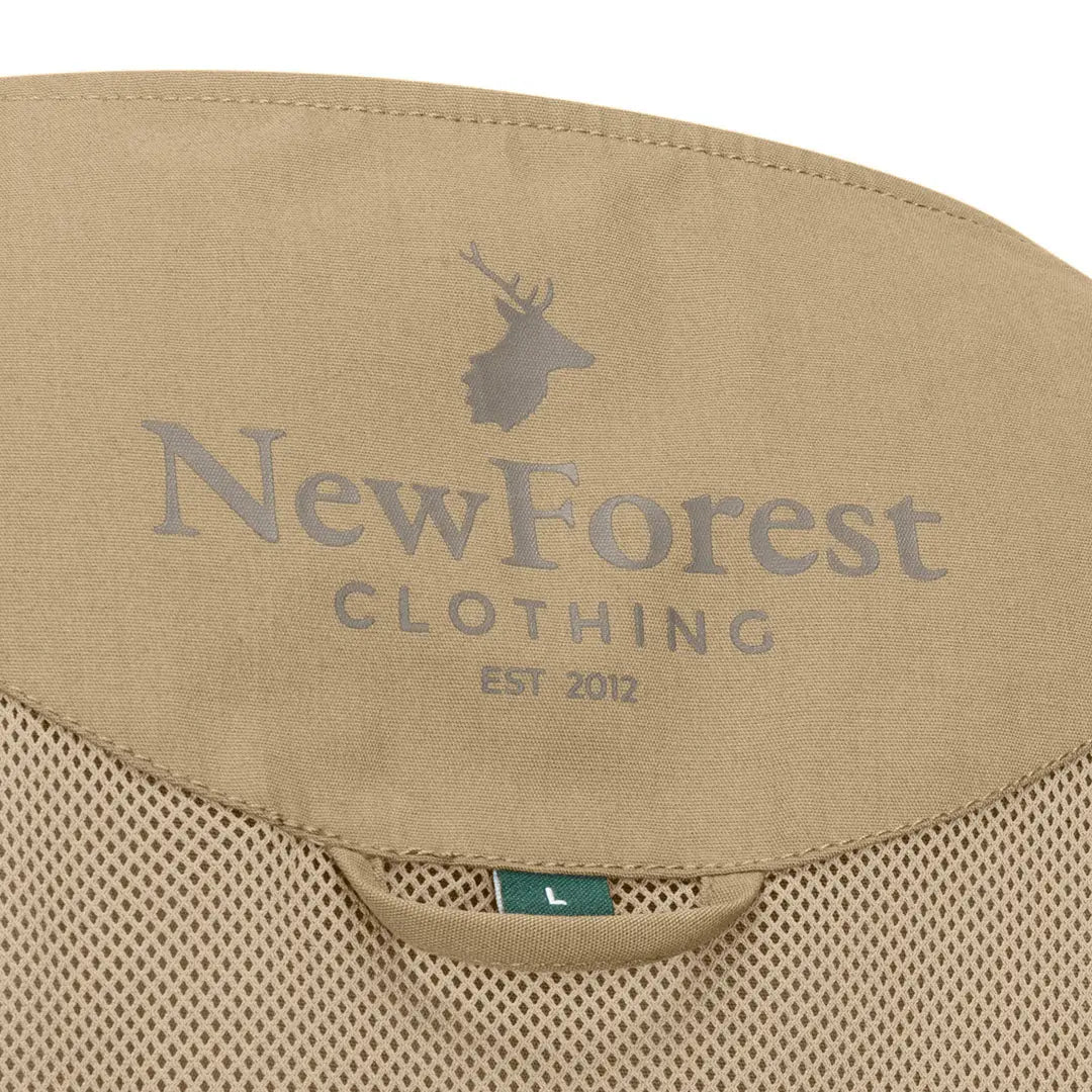 Tan clothing label on New Forest V-Neck Explorer Gilet for stylish outdoor wear