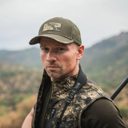 Camouflage hunting vest paired with a Seeland Ganister Truckers Cap for outdoor adventures