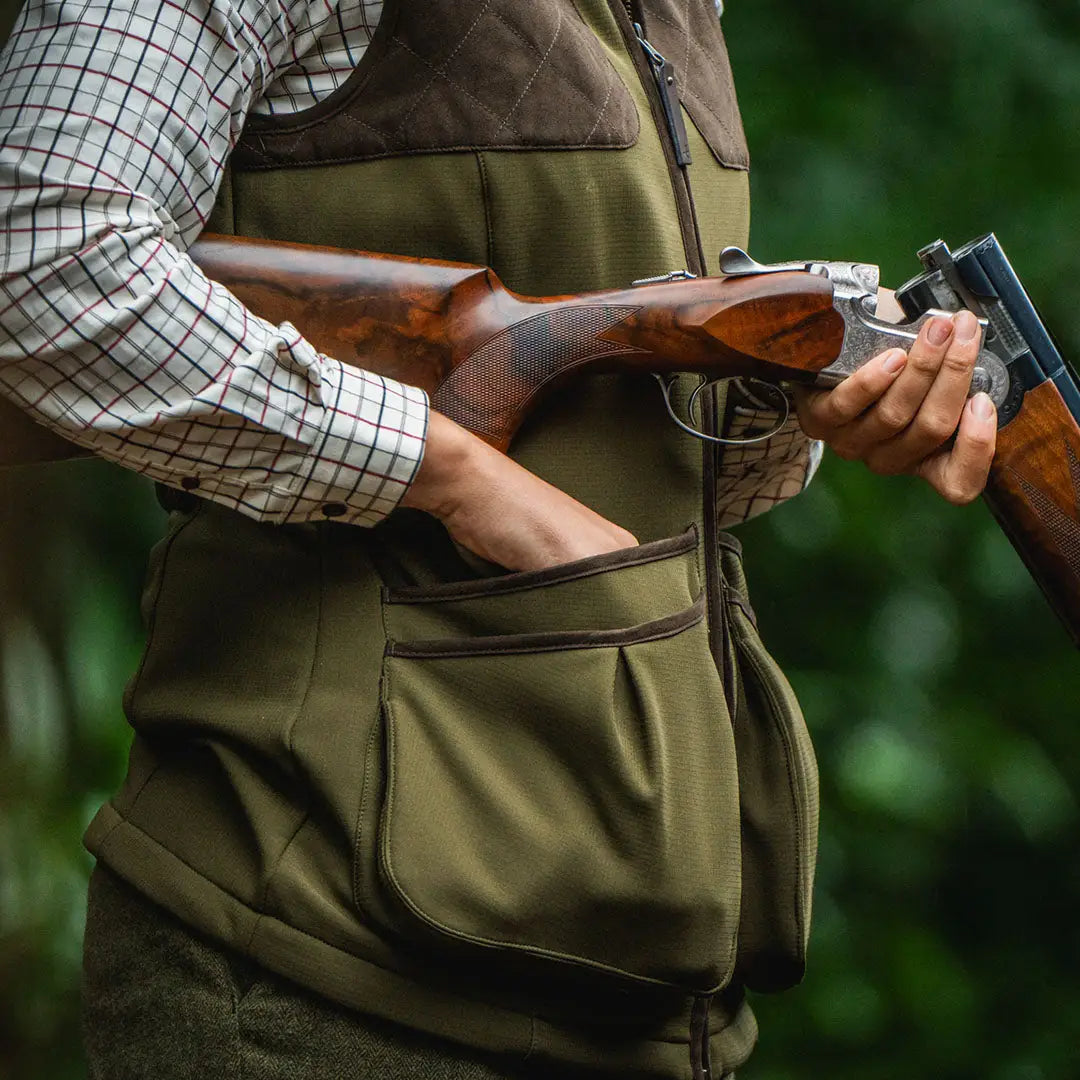 Hunter with shotgun in stylish Seeland Wenlock Faye Ladies Waistcoat for country clothing